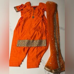 Bright orange three piece Indian suit